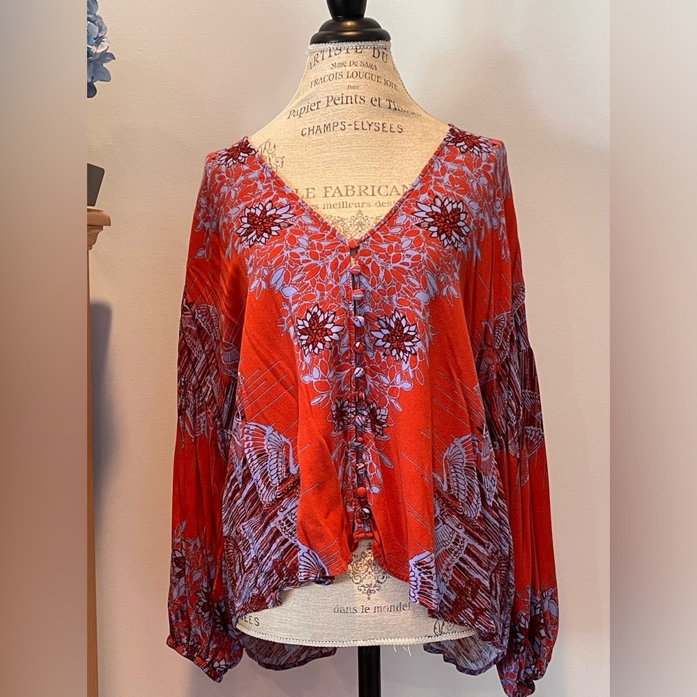 Beautiful Free People blouse size M shades of orange, rust and periwinkle blue.